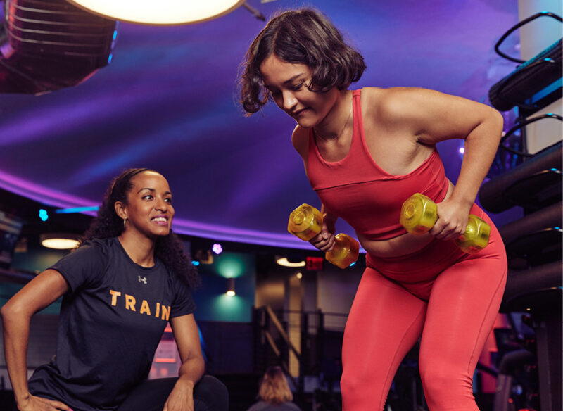 Personal trainer with client