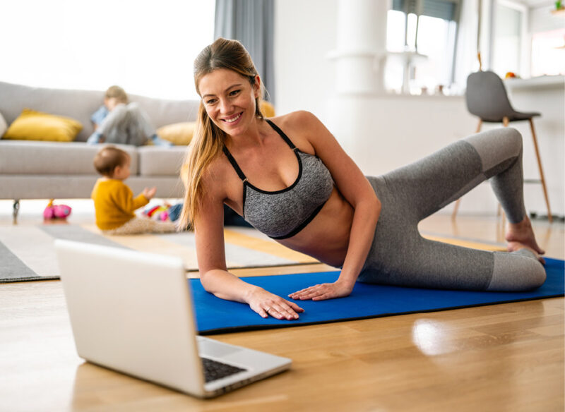person on laptop while working out
