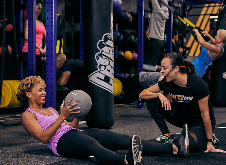 person with crunch personal trainer