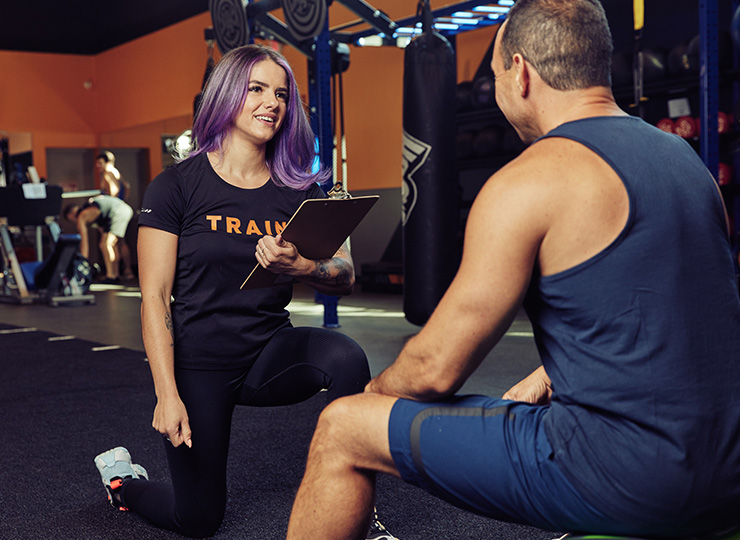 person with crunch personal trainer