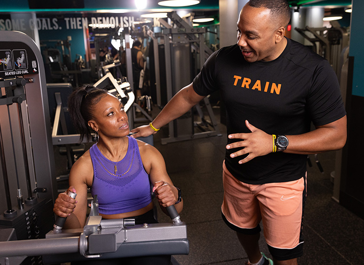 person with crunch personal trainer