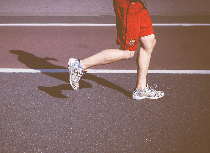 person running on track