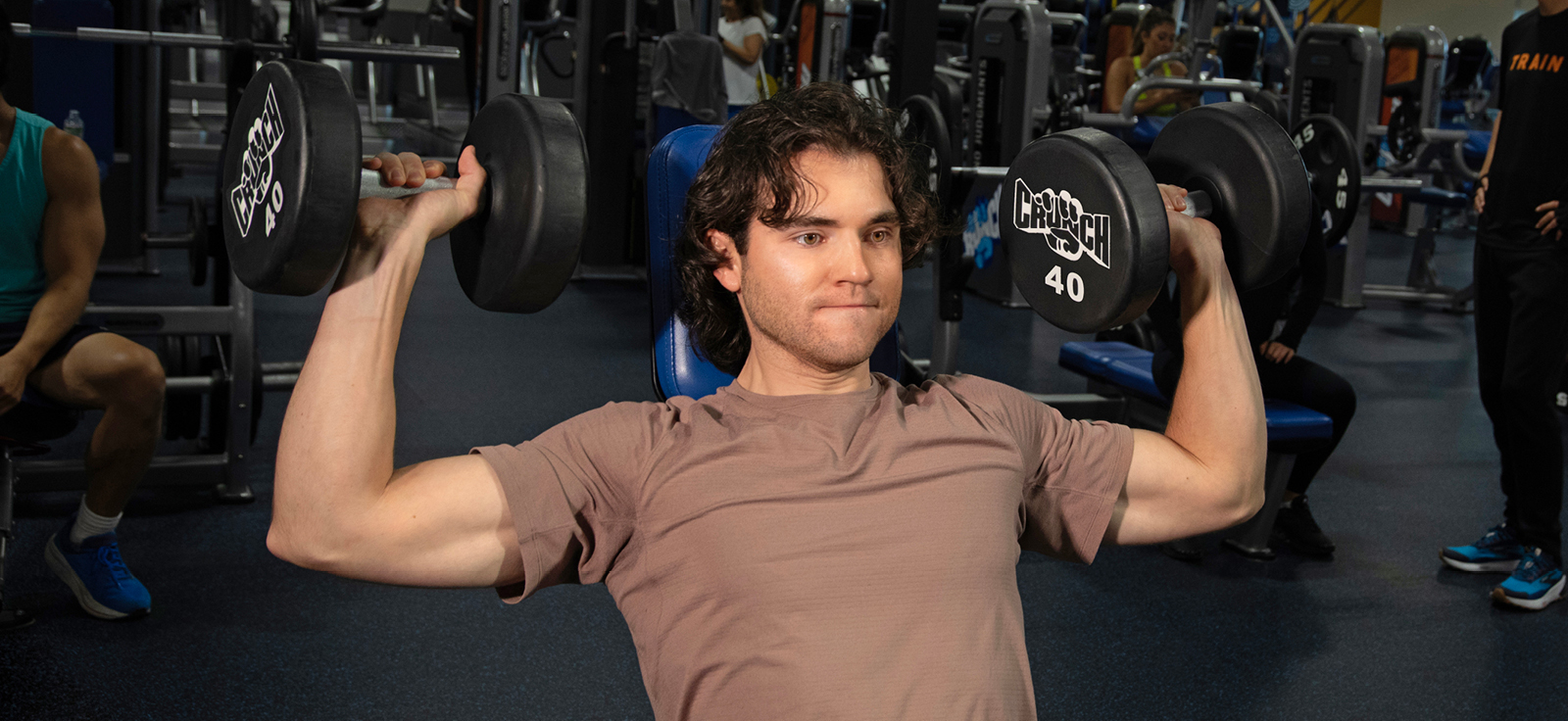 person at a crunch gym
