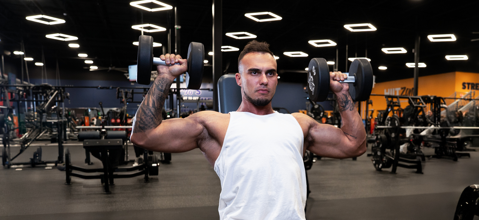 person at a crunch gym