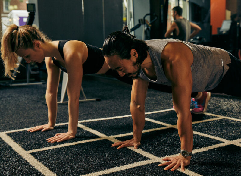 two people doing planks