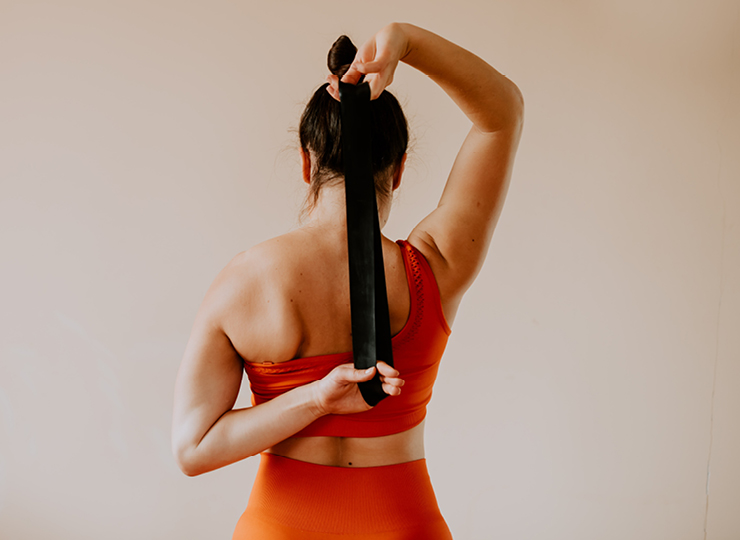 Woman using resistance band