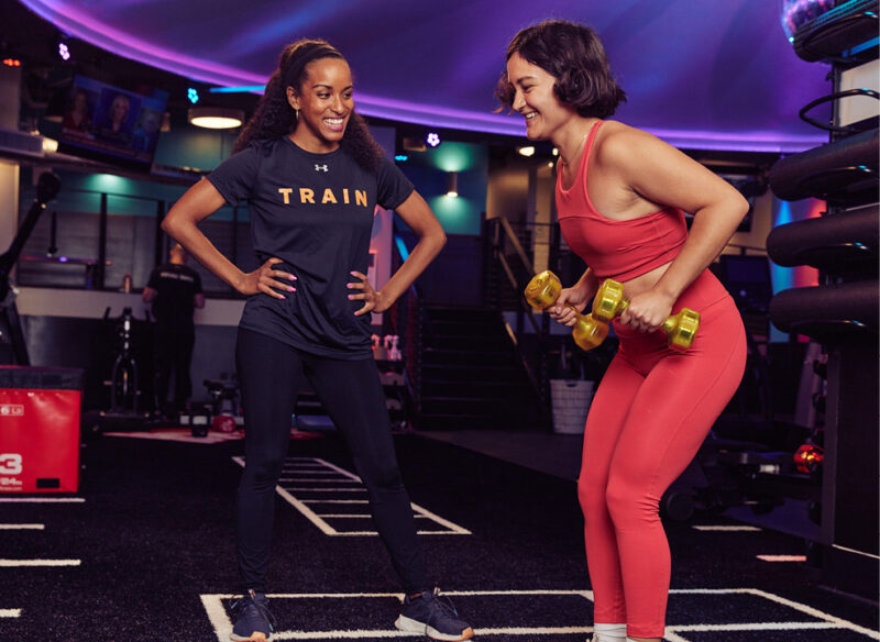 personal trainer with her client