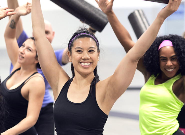 women smiling in a yoga class
