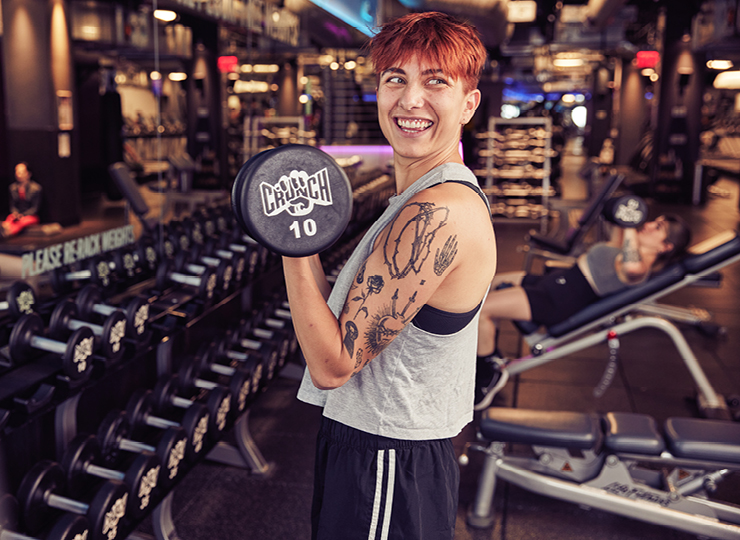Woman doing bicep curls with dumbbell