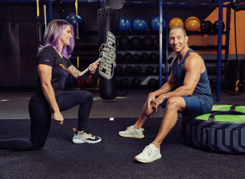person with personal trainer