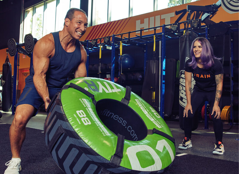 man with personal trainer
