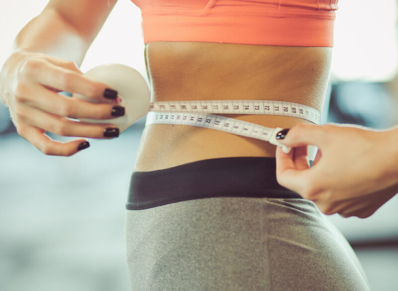 person measuring themselves