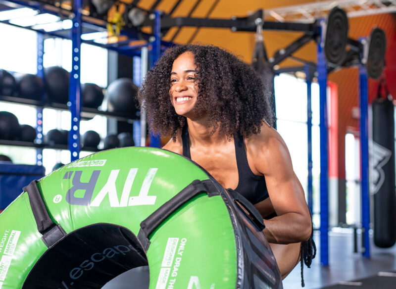 woman flipping tyre
