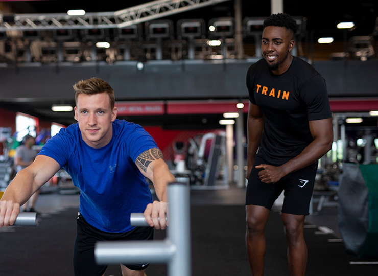 man with personal trainer