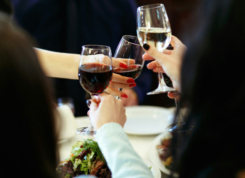 people drinking wine at a party